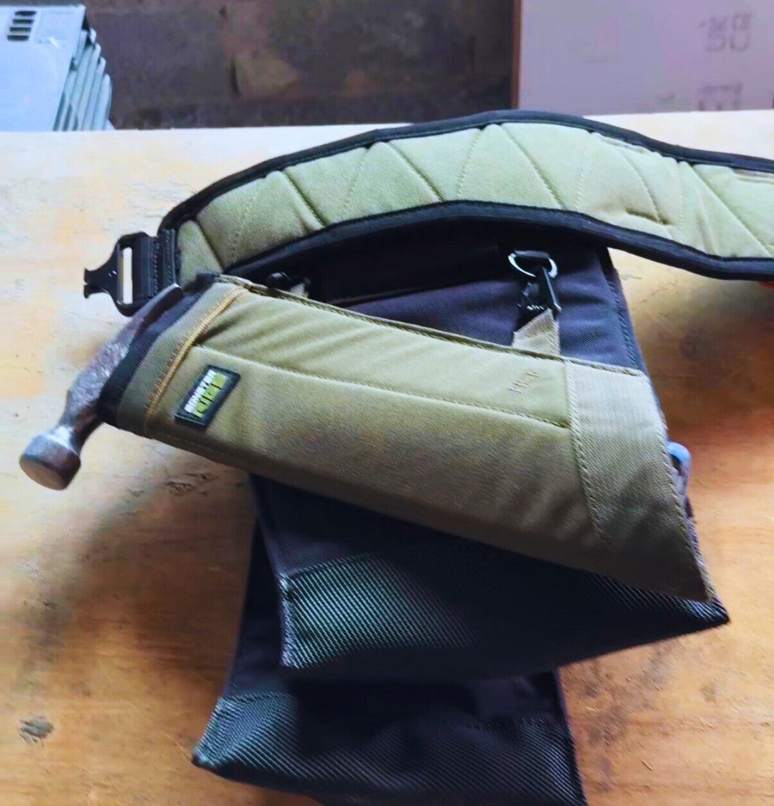 Hammer sleeve attached to the back of the tool puch